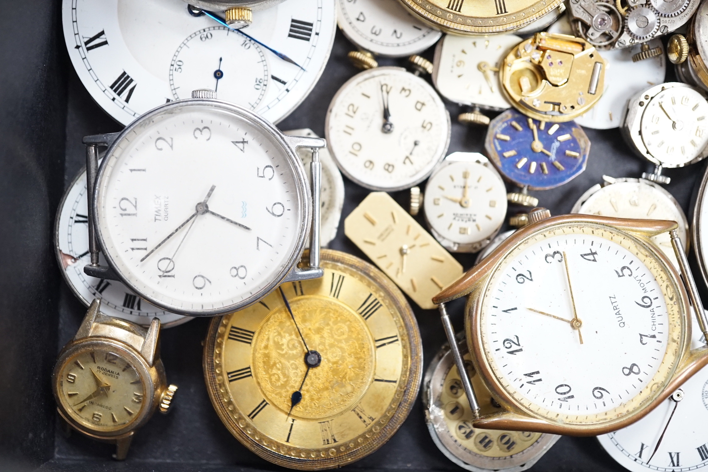 Assorted wrist wand pocket watch movements including Waltham and Rotary and a Swiss 935 standard fob watch.